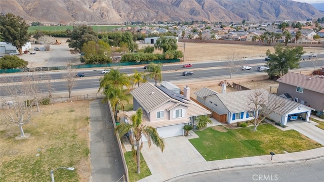 drone / aerial view featuring a mountain view