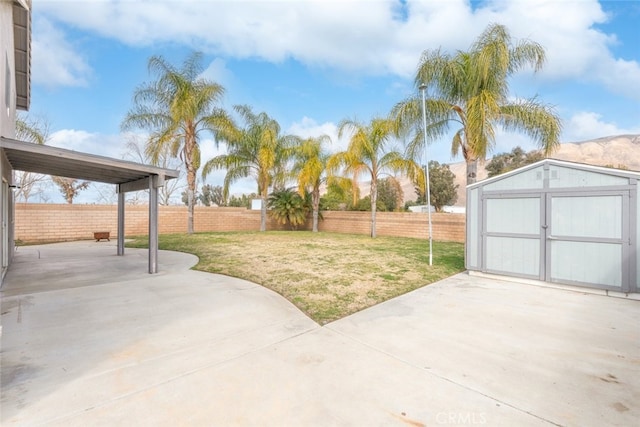 view of patio / terrace with a storage shed