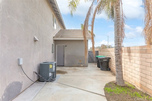 view of home's exterior featuring central AC and a patio