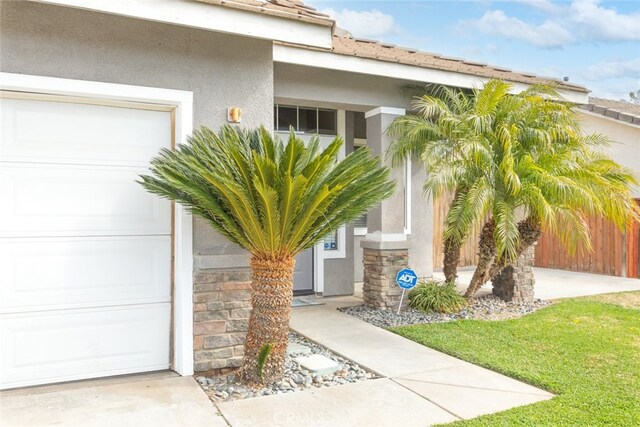 view of exterior entry featuring a garage