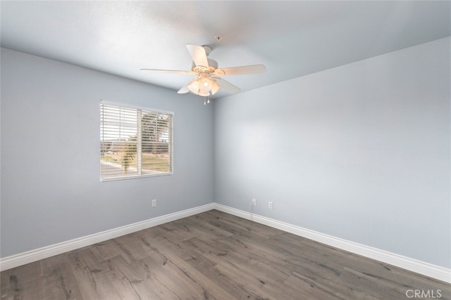 empty room featuring hardwood / wood-style floors and ceiling fan