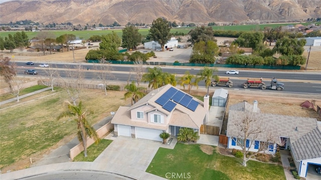 birds eye view of property featuring a mountain view