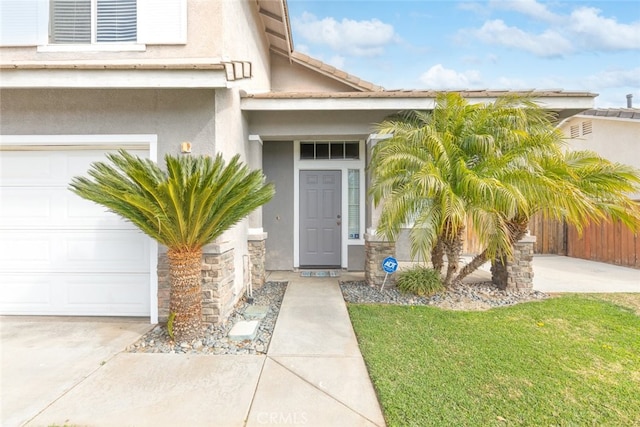 property entrance with a lawn