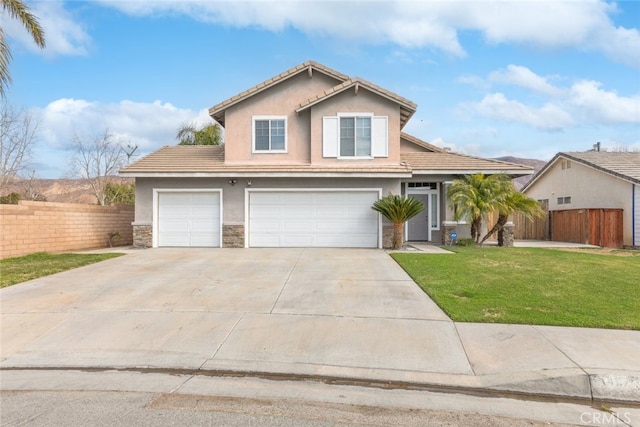 view of front property featuring a garage and a front yard