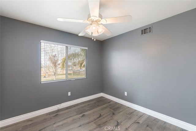 unfurnished room with wood-type flooring and ceiling fan