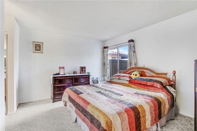 bedroom featuring light colored carpet