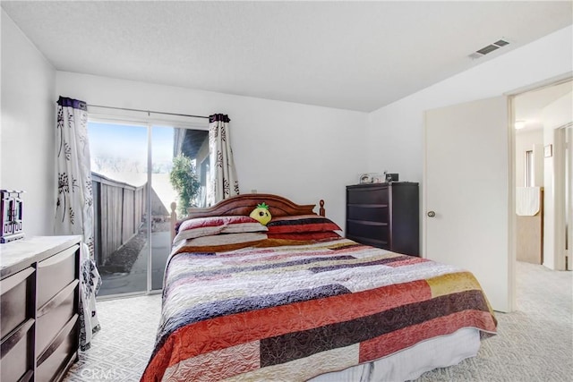 carpeted bedroom with access to outside