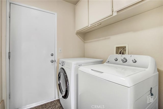 laundry area with cabinets and washing machine and clothes dryer