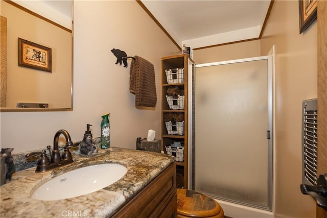 bathroom with walk in shower, vanity, and toilet