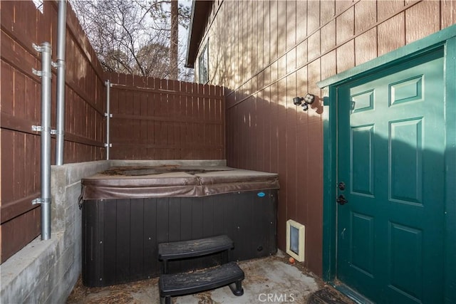 view of patio / terrace featuring a hot tub