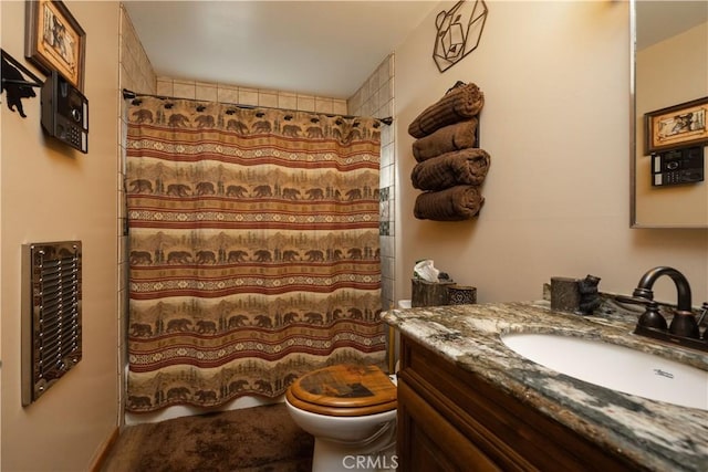 bathroom featuring wine cooler, vanity, toilet, and walk in shower