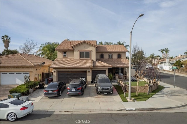 mediterranean / spanish-style home featuring a garage