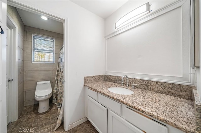 bathroom with vanity and toilet