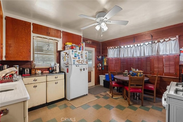 kitchen featuring ceiling fan and white appliances