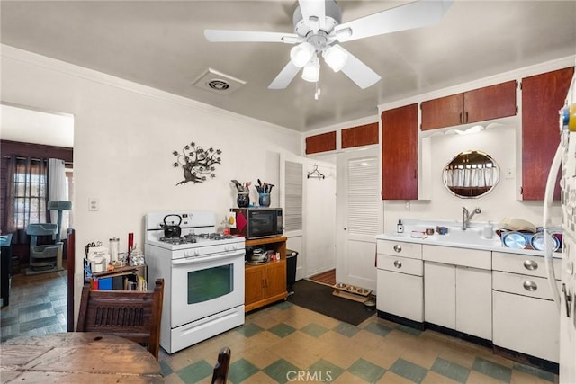 kitchen with ornamental molding, white range with gas cooktop, sink, and ceiling fan