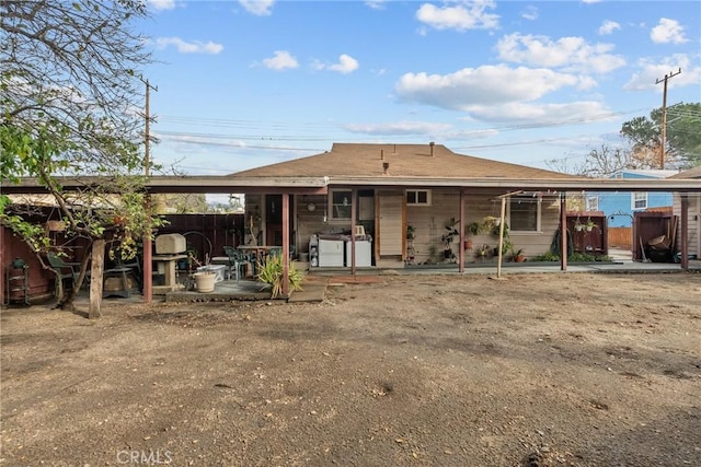 back of property with a patio area