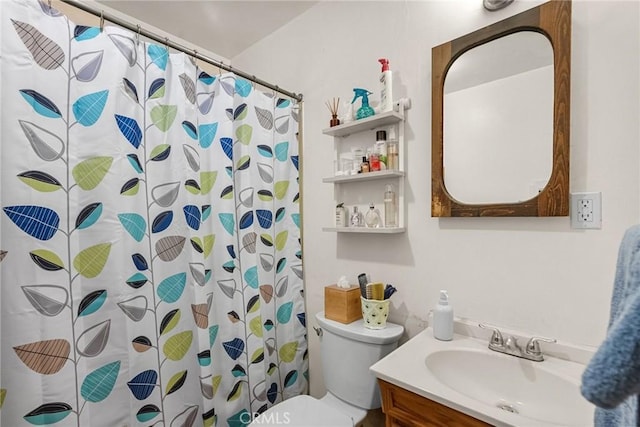 bathroom featuring vanity, curtained shower, and toilet