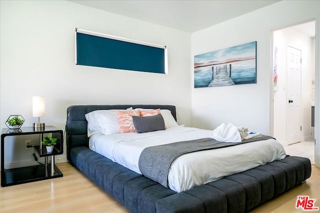 bedroom featuring light wood-type flooring