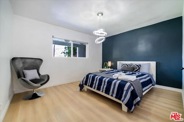 bedroom featuring hardwood / wood-style flooring