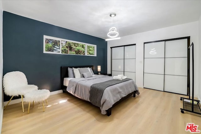 bedroom with light wood-type flooring