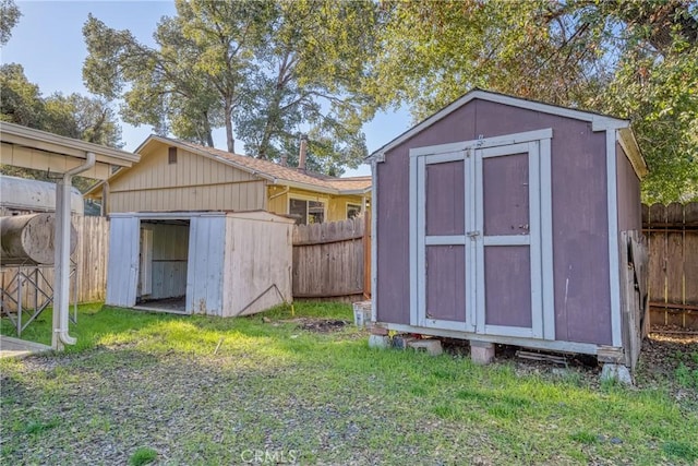 view of outbuilding featuring a lawn