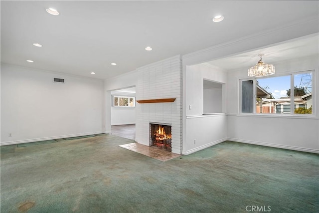 unfurnished living room featuring crown molding, carpet, and a brick fireplace