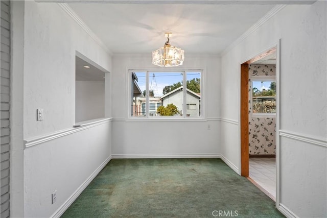 unfurnished dining area with dark colored carpet, ornamental molding, and a chandelier