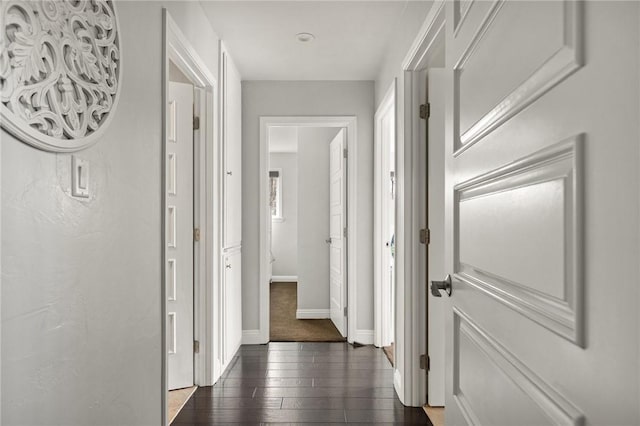 corridor featuring dark hardwood / wood-style floors