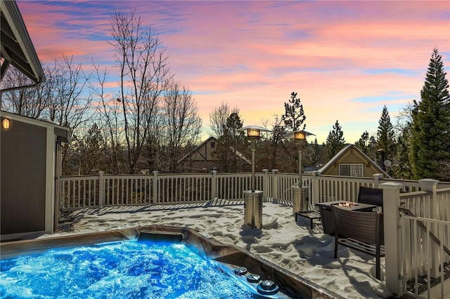 pool at dusk with a deck