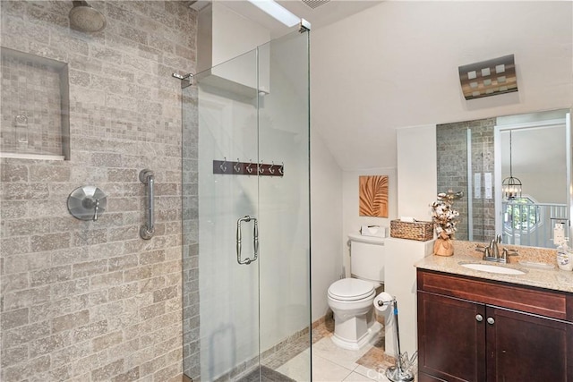 bathroom with vanity, tile patterned flooring, toilet, and walk in shower