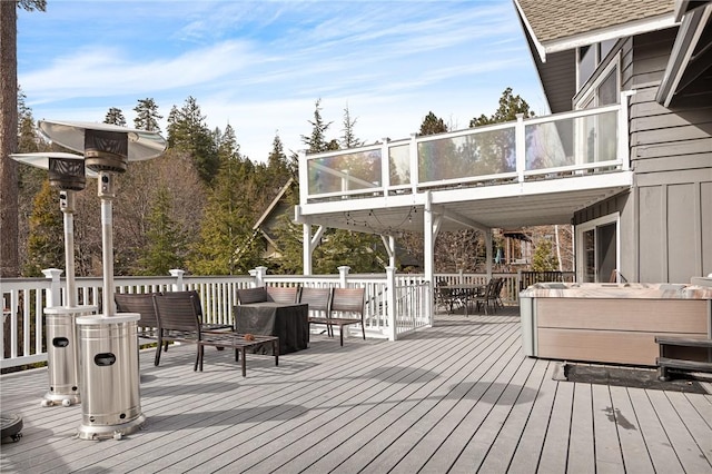 wooden deck featuring outdoor lounge area