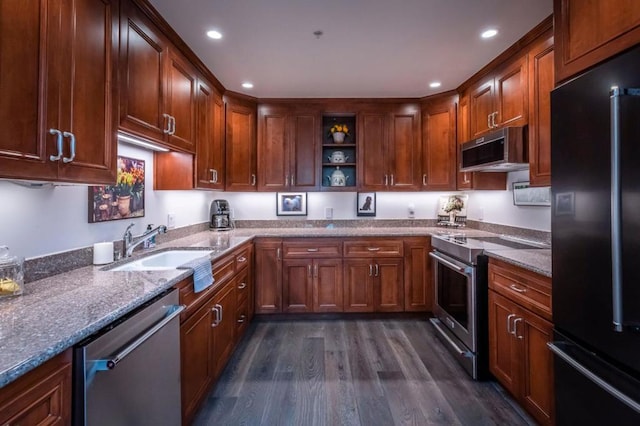 kitchen with stainless steel appliances, light stone countertops, dark wood-type flooring, and sink