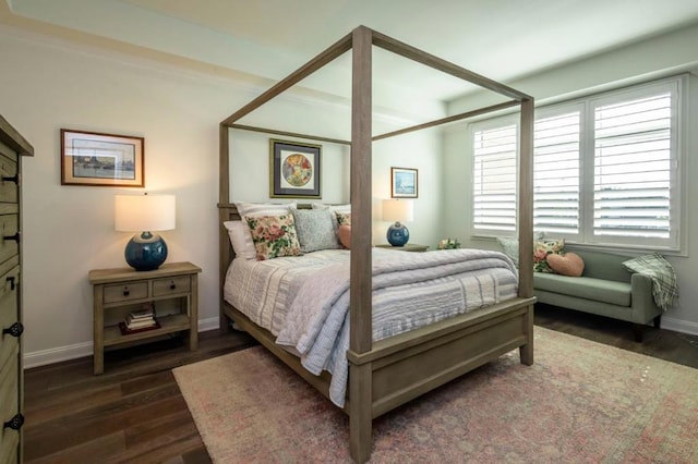 bedroom with dark wood-type flooring