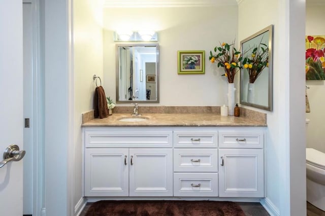 bathroom featuring vanity and toilet