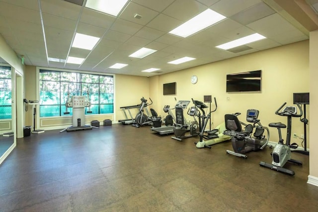 gym with a paneled ceiling