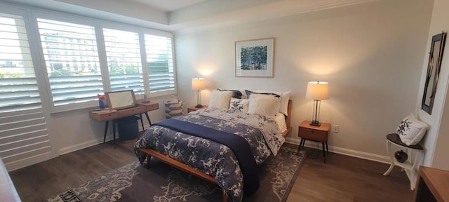 bedroom with dark wood-type flooring