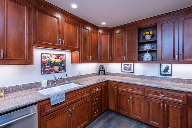 kitchen with sink, stainless steel dishwasher, light stone countertops, and dark hardwood / wood-style floors