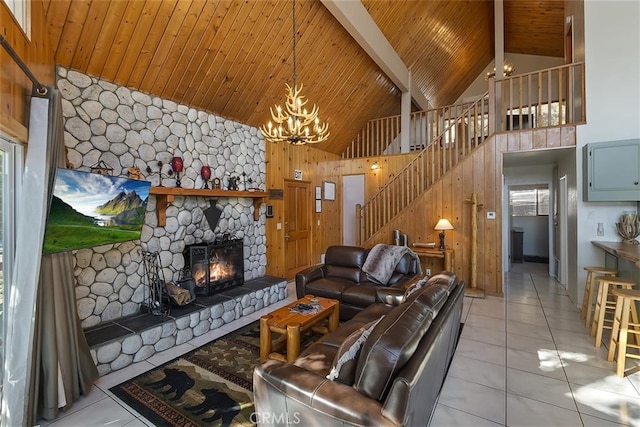 tiled living room featuring wood walls, wooden ceiling, high vaulted ceiling, and a notable chandelier