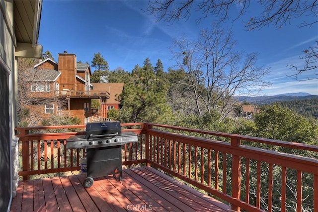 wooden deck with area for grilling