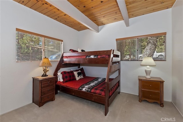 carpeted bedroom featuring wood ceiling, multiple windows, and vaulted ceiling with beams