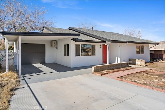 ranch-style house with a carport and a garage