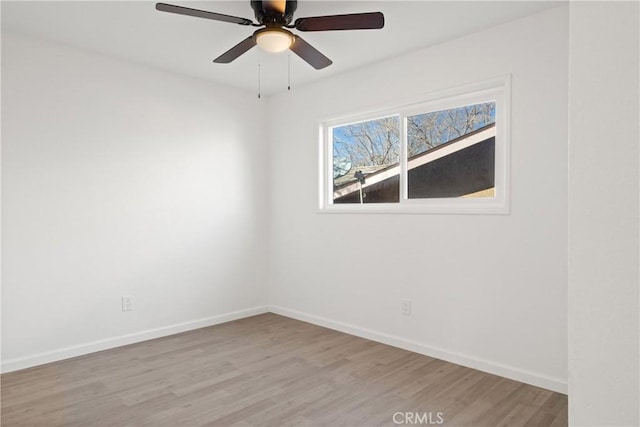 unfurnished room featuring ceiling fan and light hardwood / wood-style flooring