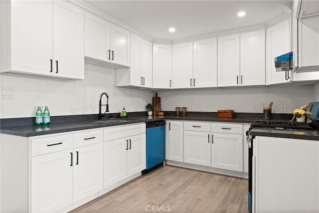 kitchen with white cabinets, dishwashing machine, sink, and stainless steel gas stove