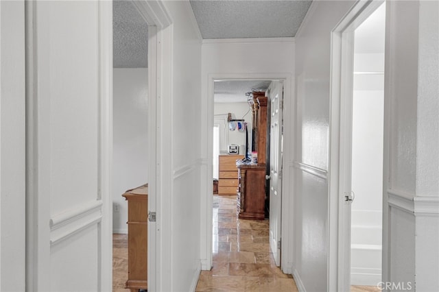 corridor featuring a textured ceiling