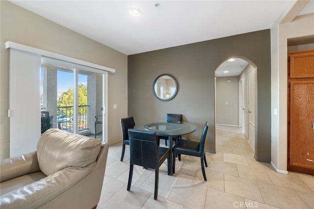 dining area featuring light tile patterned floors