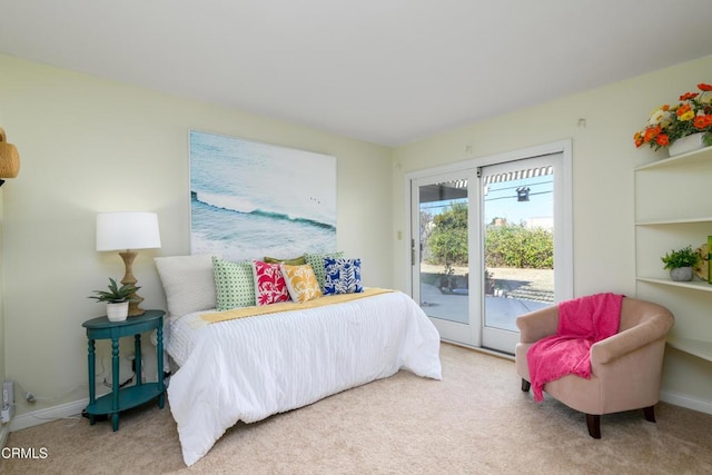 carpeted bedroom featuring access to outside