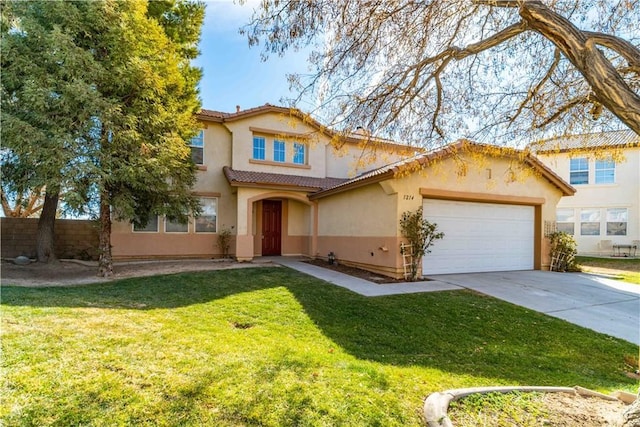 mediterranean / spanish-style home with a garage and a front yard