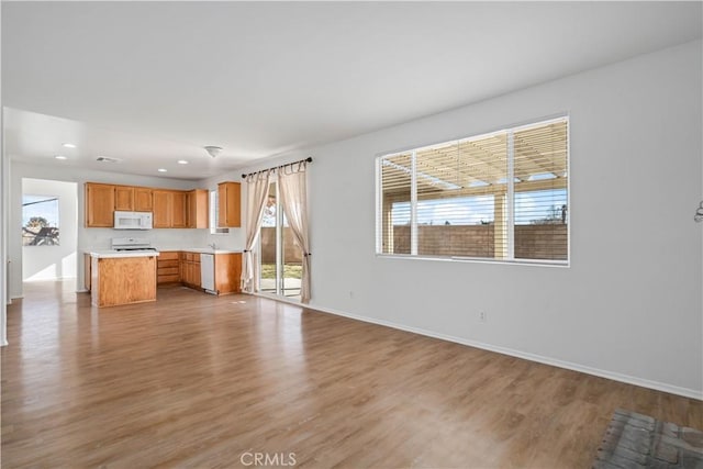 kitchen featuring white appliances and light wood-type flooring