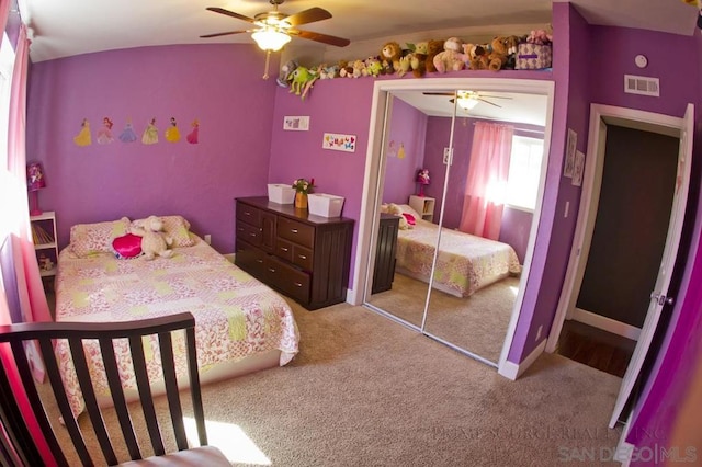 bedroom featuring a closet, ceiling fan, and carpet flooring