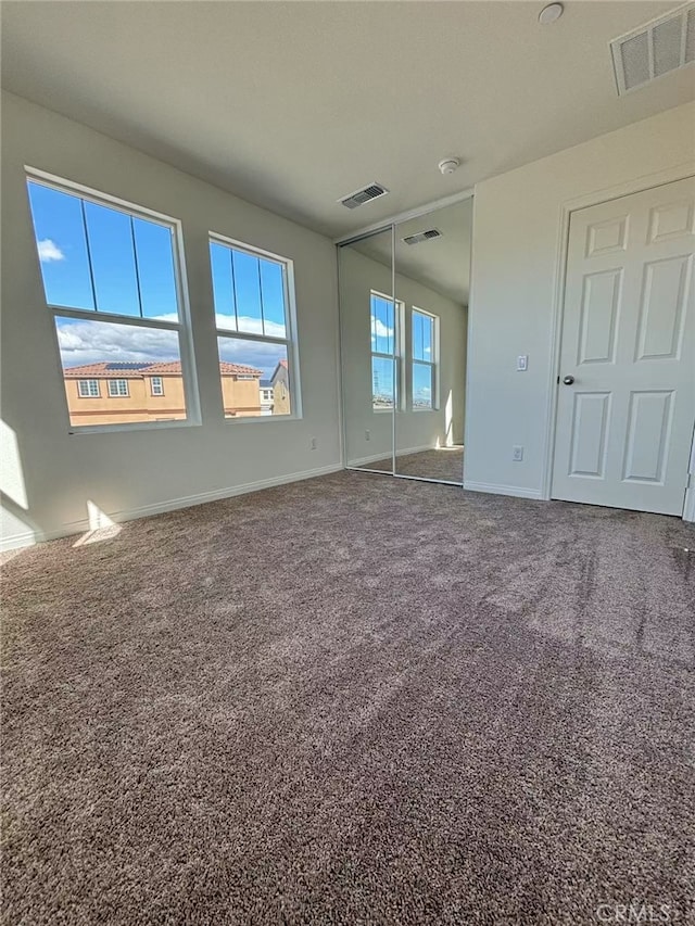 view of carpeted spare room